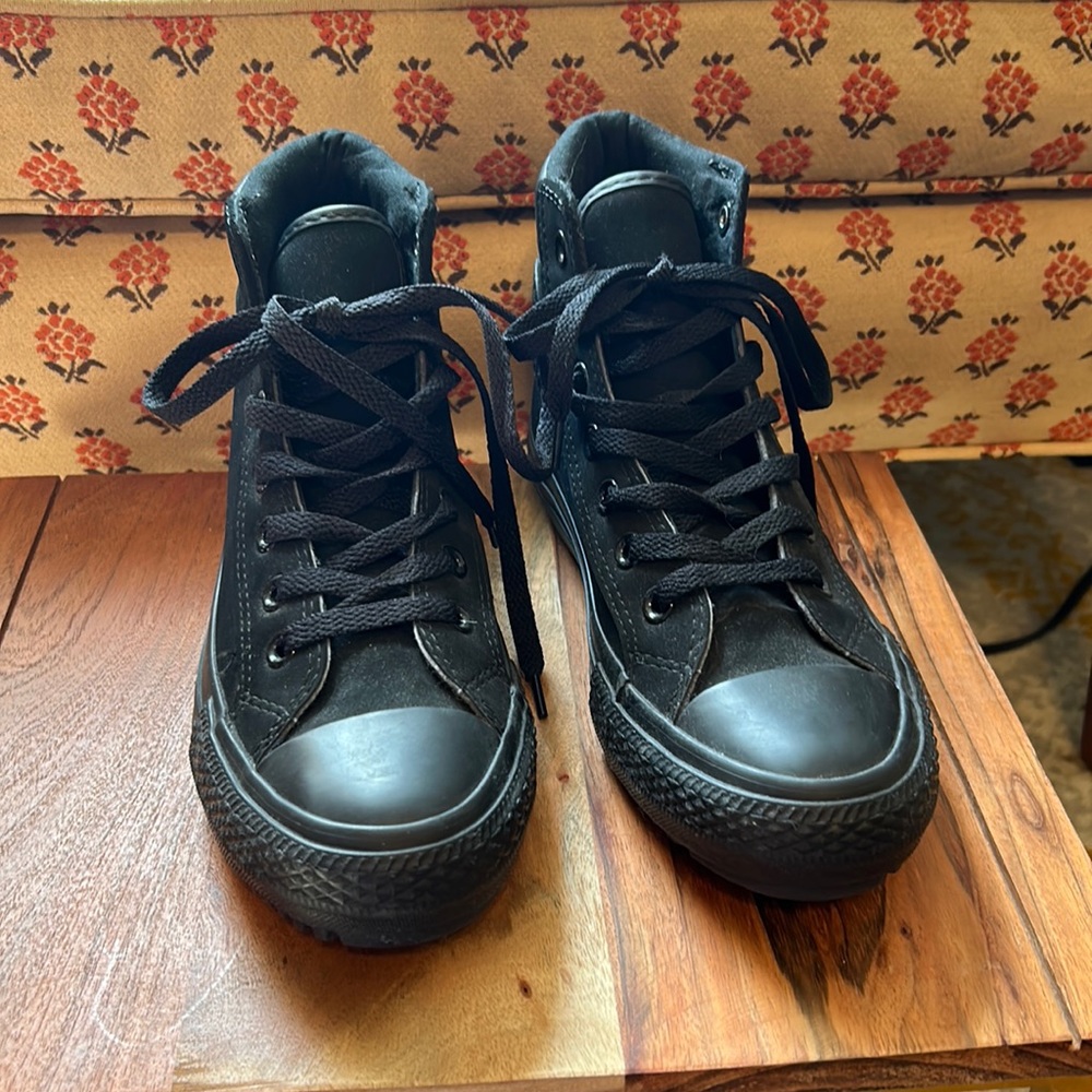 Brand new. Never worn out of the house. Black Converse high tops.